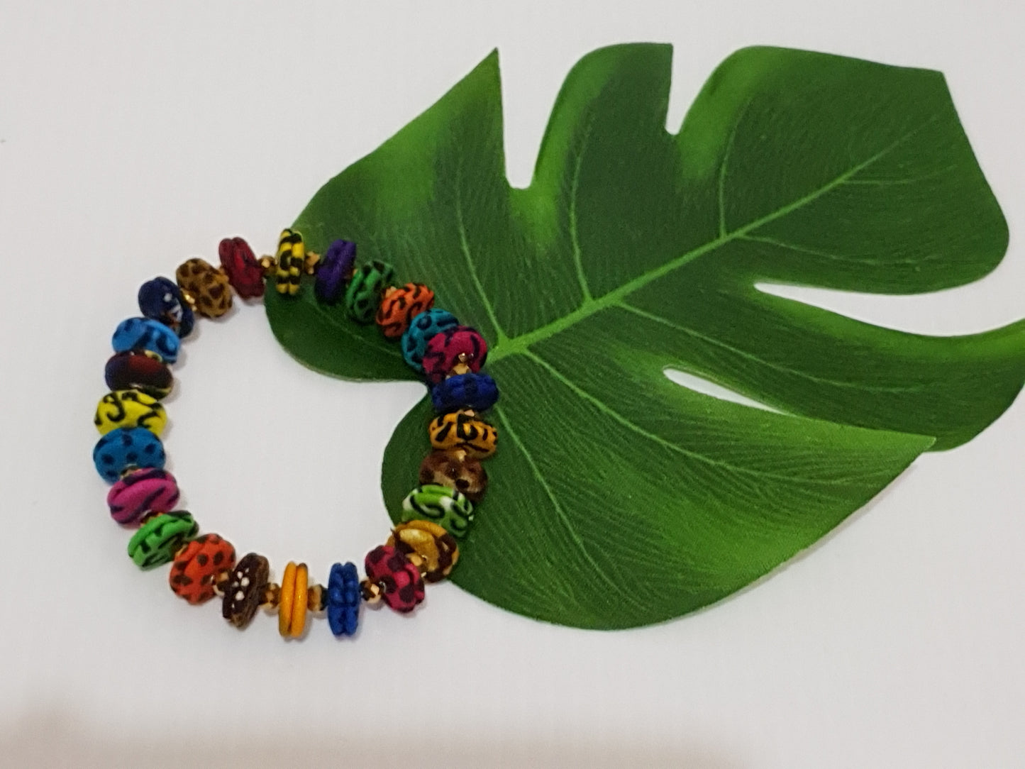 Handmade small colourful African fabric bracelet
