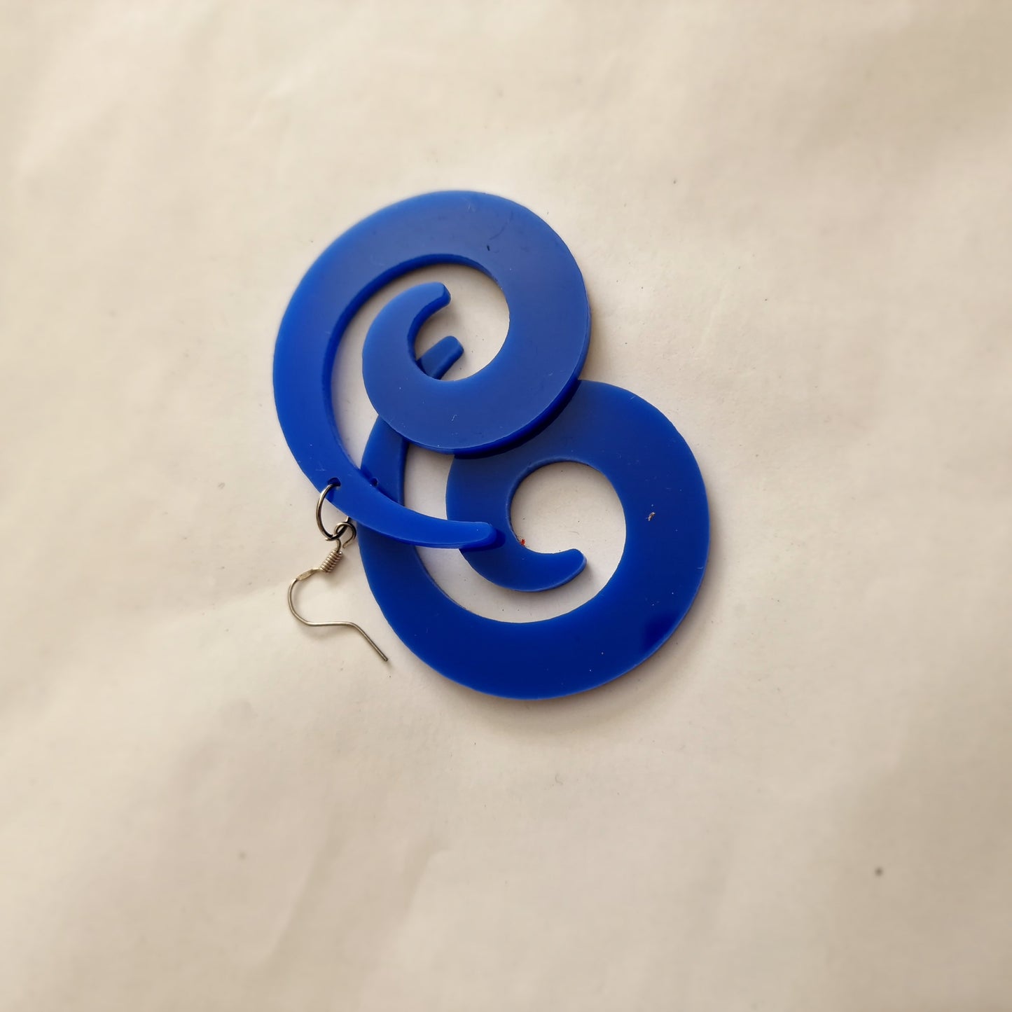 Blue twirl statement earrings