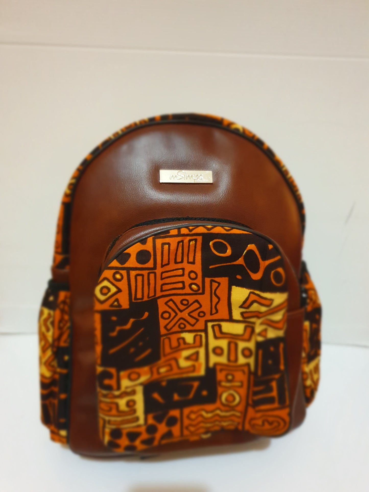 Leather and African brown print backpack