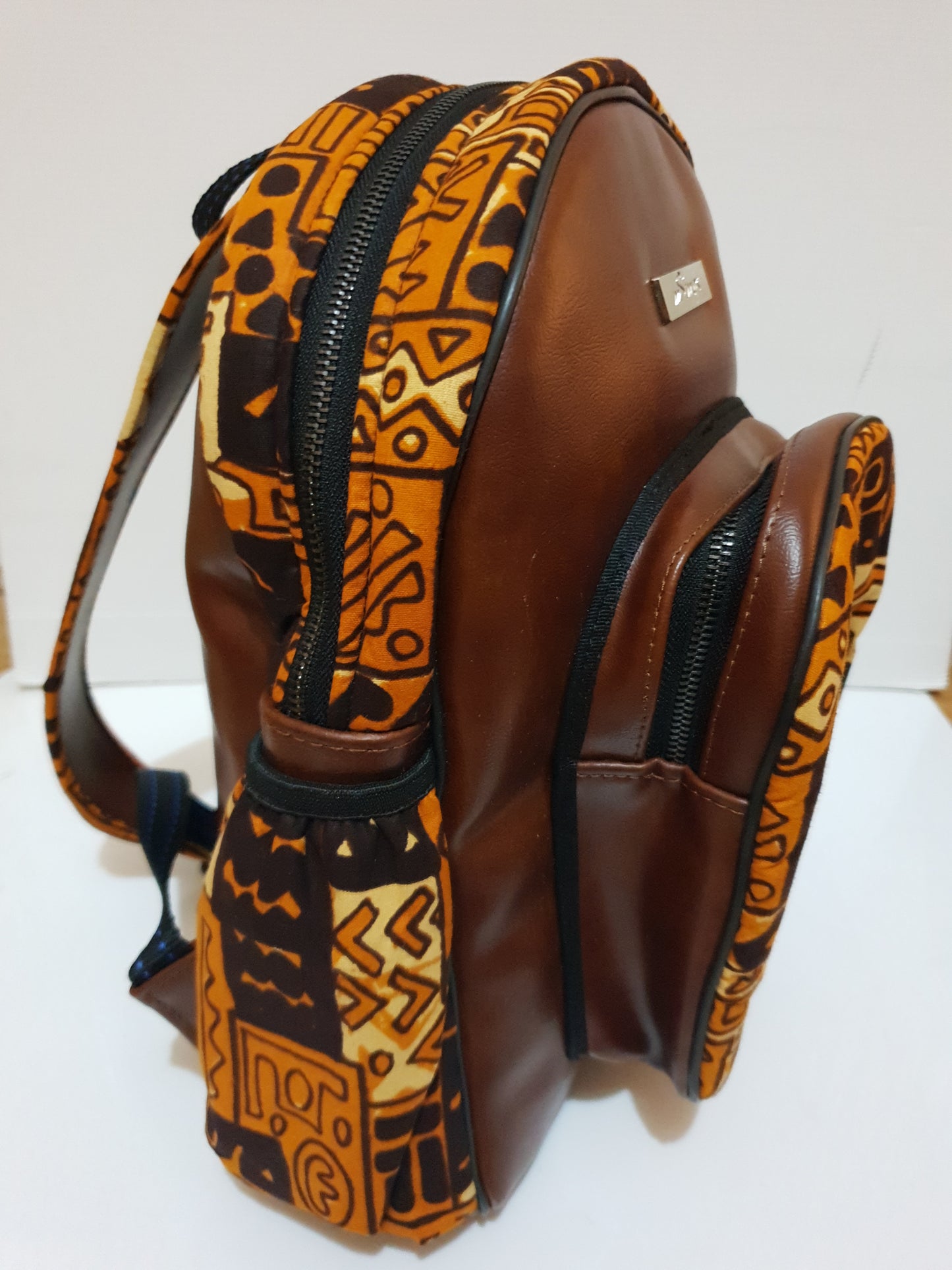 Leather and African brown print backpack