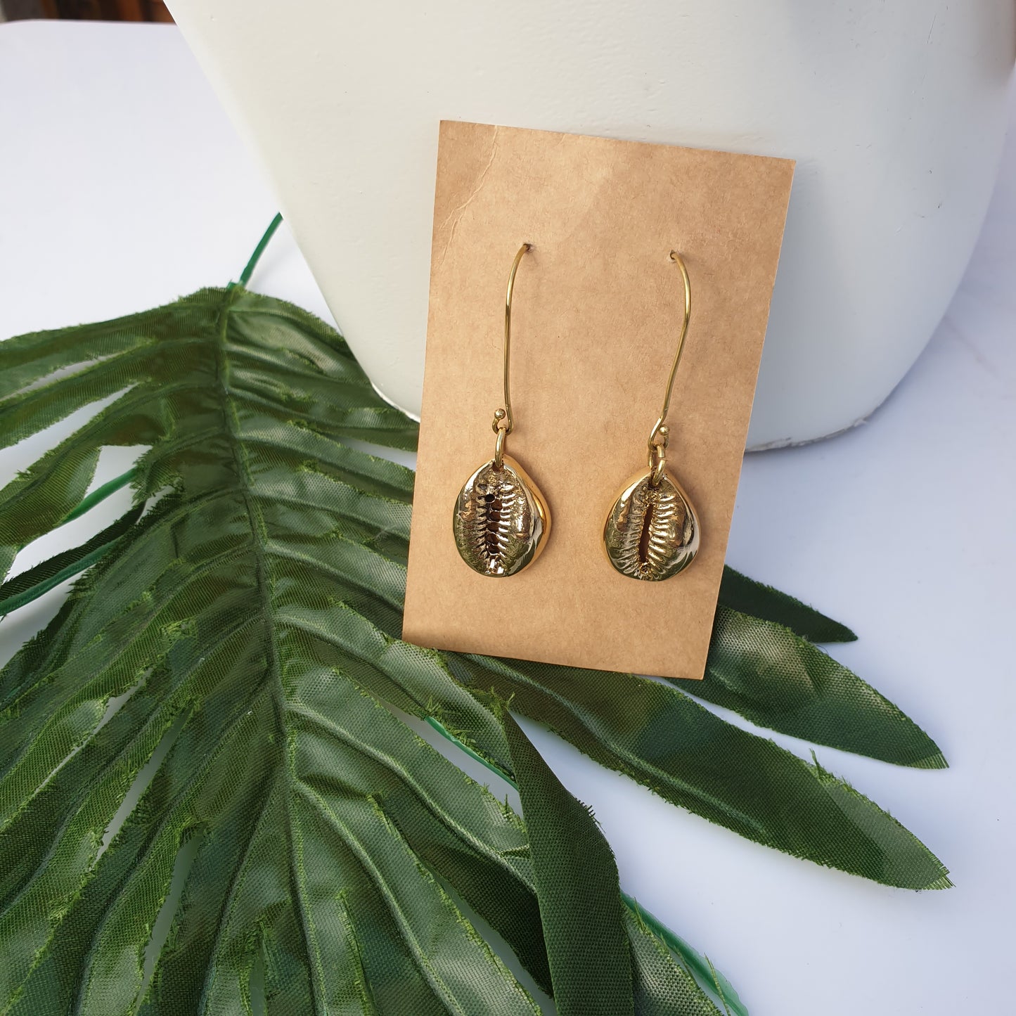 Brass cowrie shell statement earrings