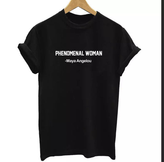 A black t-shirt with the phrase 'PHENOMENAL WOMAN -Maya Angelou' printed in white on the front.