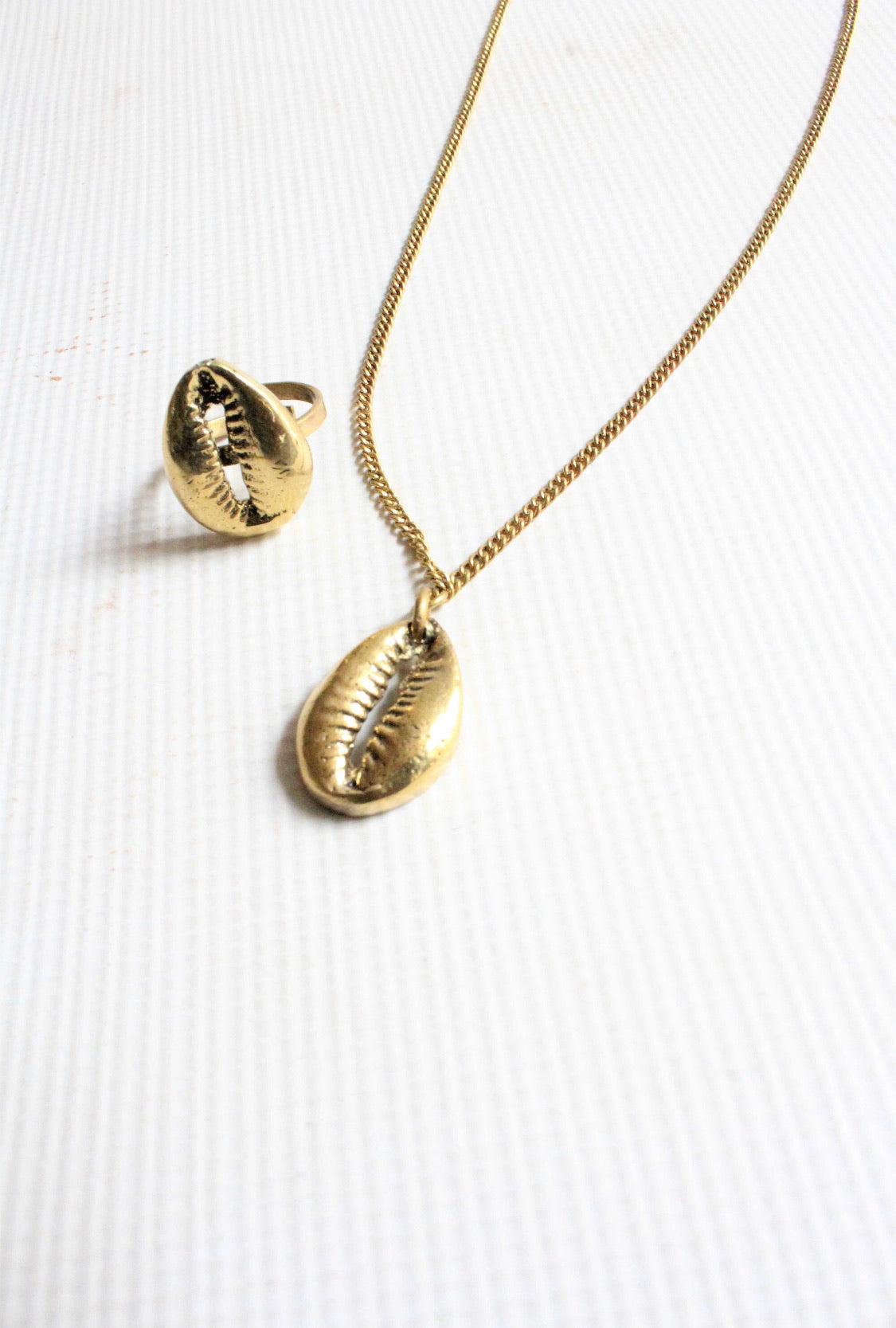 Brass cowrie shell statement ring