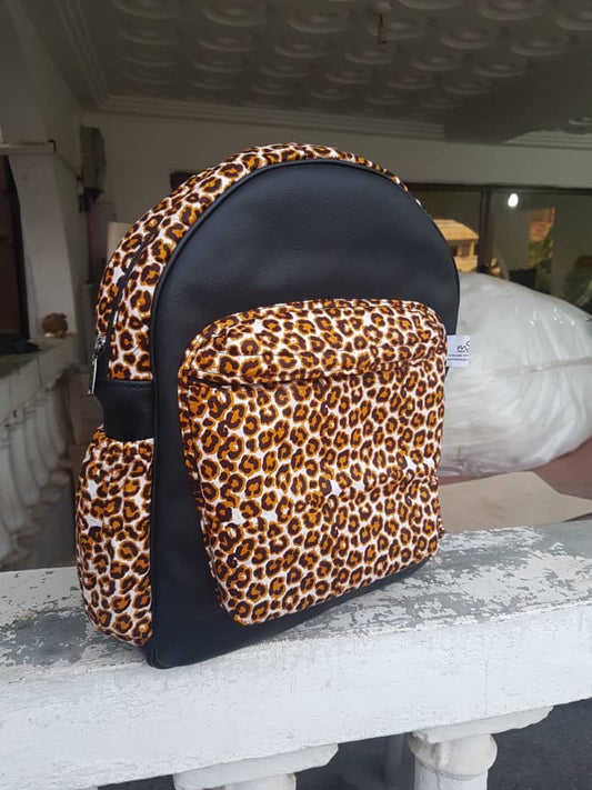 Black and leopard print handmade Leather and African print backpack