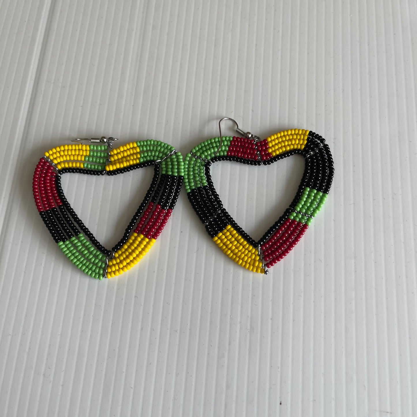 Red, yellow, green and black coloured Kenyan earrings