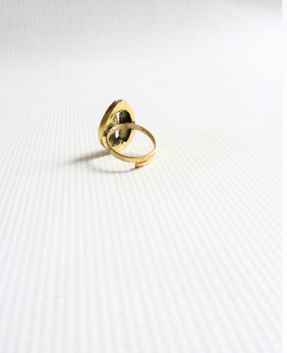 Brass cowrie shell statement ring