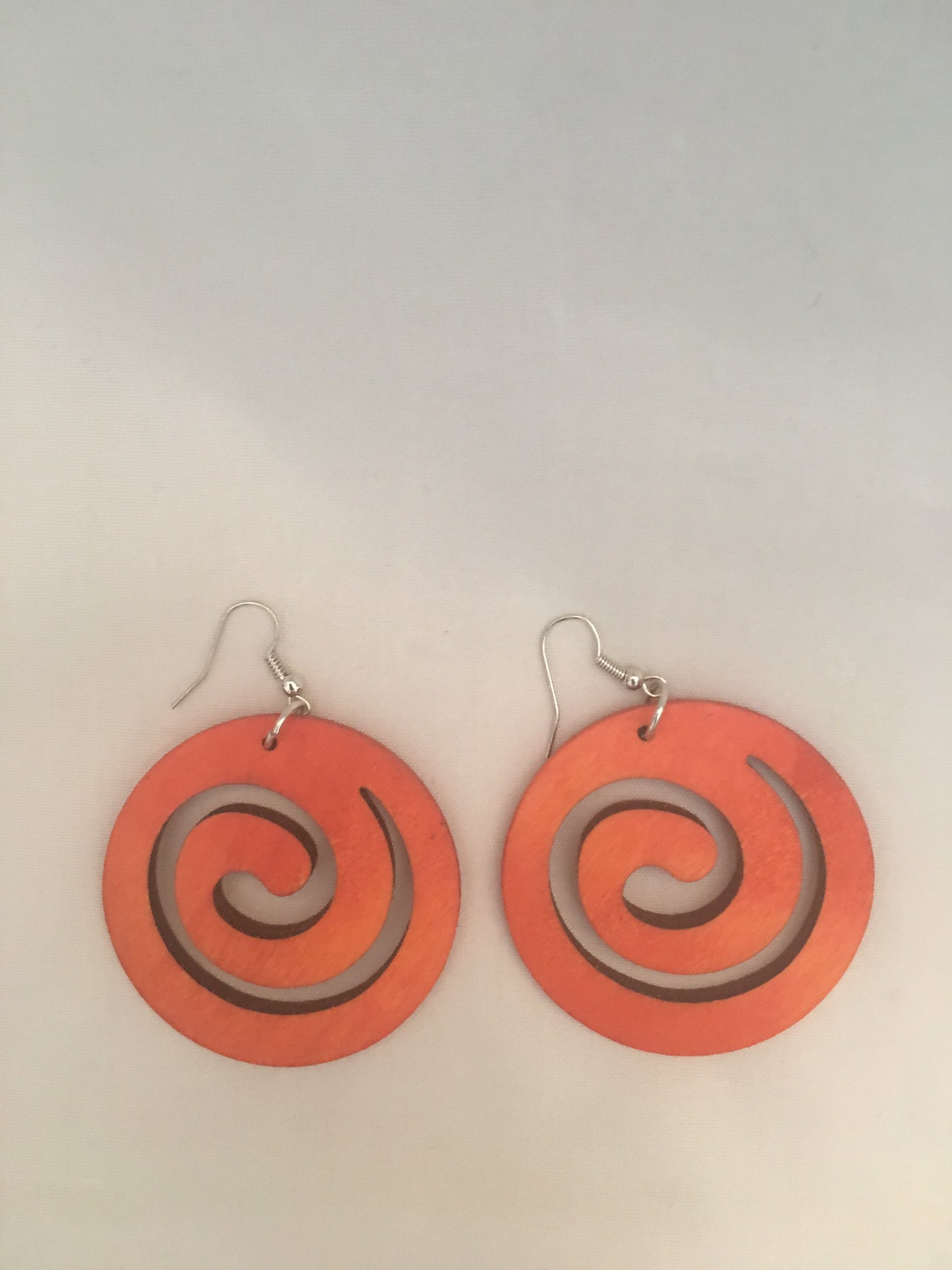Wooden swirl earrings - orange